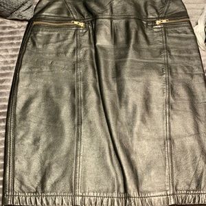 Black genuine leather skirt with zippers.